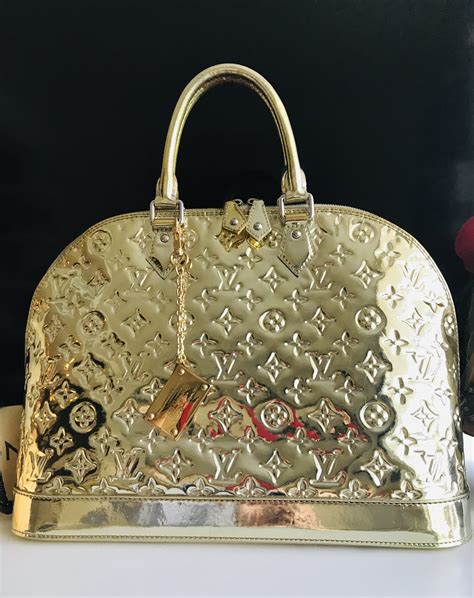 louis vuitton gold purse